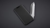 Multipurpose mobile phone with pocket knife. Dark background.